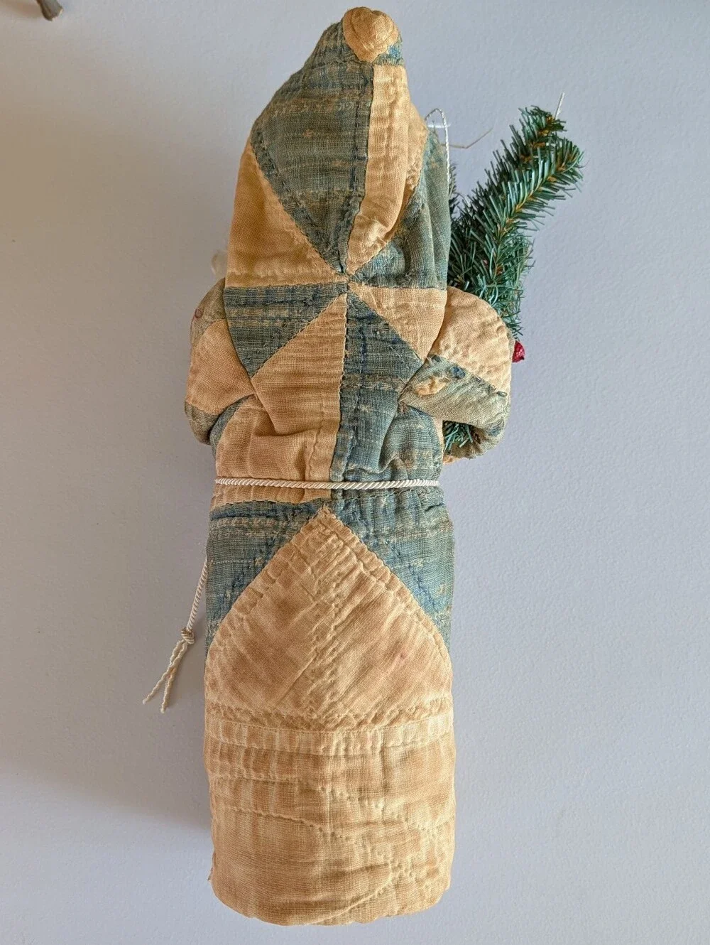 FOLK ART SANTA CLAUS wearing an antique quilt
